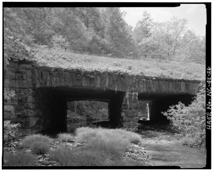 File:Otter Creek Bridge -5. View of elevation of stone facing on concrete box culvert. Stone facing appears on the headwall, tail wall, wingwalls, interior abutment wall and the pier HAER NC,11-ASHV.V,2-26.tif