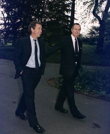 George W. Bush with his father outside the White House, April 29, 1992 President Bush walks up the South Lawn towards the Oval Office with his son, George W. Bush - NARA - 186449.tif