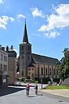 Two cyclists by the church in Consdorf