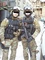 Two operators of the SOBR special police force wearing MultiCam fatigues