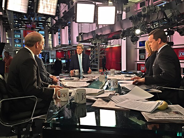 U.S. Secretary of State John Kerry talks with Nicolle Wallace, Mike Barnicle, Mark Halperin, Richard Haass, and Katty Kay during an appearance on Sept