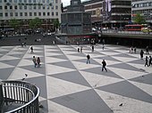 Location filming for the opening sequence took place in Stockholm, including at Sergel's Square Sergels torg stockholm sweden 20040512.jpg