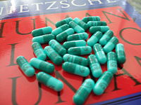 A month's supply of Sonata 10mg capsule on a copy of Nietzsche's Human, All Too Human.