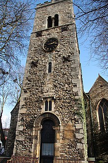 The west tower shows the dedication stone to the right of the doorway St.Mary-le-Wigford's tower - geograph.org.uk - 1707480.jpg