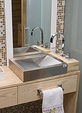 Bathroom stainless steel vessel sink standing on a wood surface Stainless Steel Sink.jpg