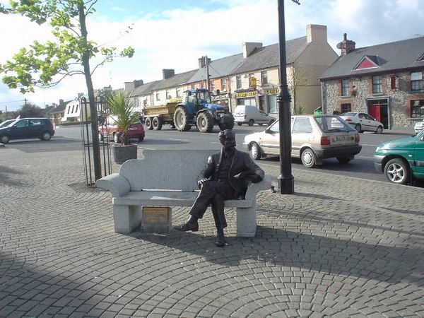 Bronze figure of Percy French in the town square with words and music of "Come back Paddy Reilly to Ballyjamesduff".