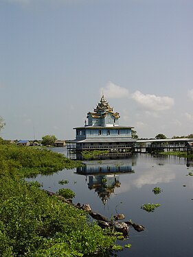 Buddhist Temple reflected on (lake) Tonle Sap, Cambodia.