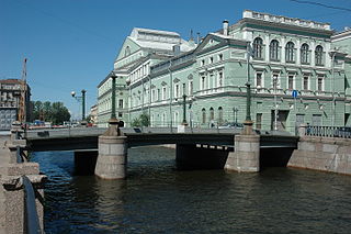 Torgovy Bridge is a steel girder bridge across the Kryukov Canal in the Admiralteysky District of Saint Petersburg, Russia. The bridge connects the Kolomensky and Kazansky Islands. The bridge has retained the architectural appearance that is characteristic of the bridges of the Kryukov Canal during the 1780s. Torgovy Bridge is a monument of history and culture.