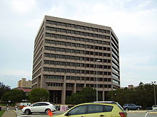 The main offices of the Railroad Commission of Texas are located in the William B. Travis State Office Building. TravisStateOfficeBuilding.JPG