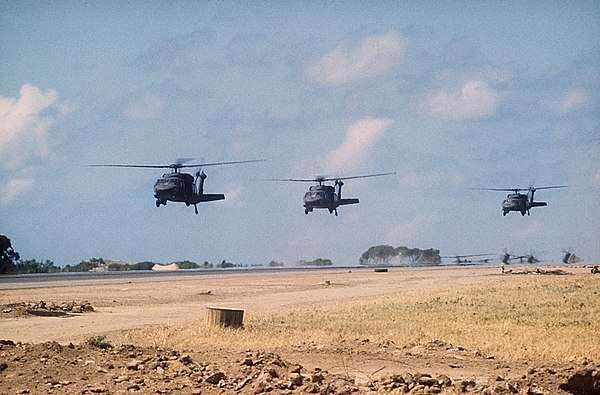UH-60A Black Hawks over Port Salinas during the invasion of Grenada, 1983. The conflict saw the first use of the UH-60 in combat.