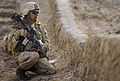 US Navy 091106-M-2581P-778 Hospital Corpsman 3rd Class Eric Nobriga, assigned to Combined Anti-Armor Team (CAAT) 2, 1st Battalion, 5th Marine Regiment, takes a security halt during a foot patrol.jpg
