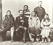 Delegation of Ute Indians in Washington, D.C. in 1880. Background: Woretsiz and general Charles Adams (Colorado Indian agent) are standing. Front from left to right: Chief Ignacio of the Southern Utes; Carl Schurz US Secretary of the Interior; Chief Ouray and his wife Chipeta. Ute delegation.jpg