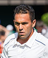 Víctor Estrella Burgos competing in the first round of the 2015 Wimbledon Championships.