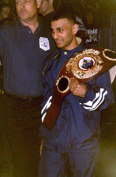 Hamed with the WBO featherweight title at a WWF event, 1997