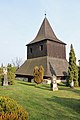 Dřevěná zvonice na hřbitově u kostela