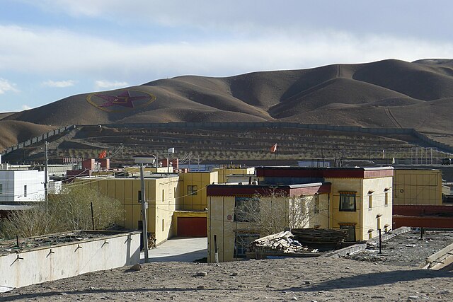 A view of the northern hill slopes from Shiquanhe; A giant PLA emblem is imprinted on the hillside on the left