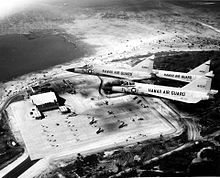 The Hawaii Air National Guard F-102 'Deuces' fly over the new 154th Wing complex. The 154th Wing hangar complex was dedicated 17 February 1962, during the Hawaii Air National Guard's 15th anniversary luau.