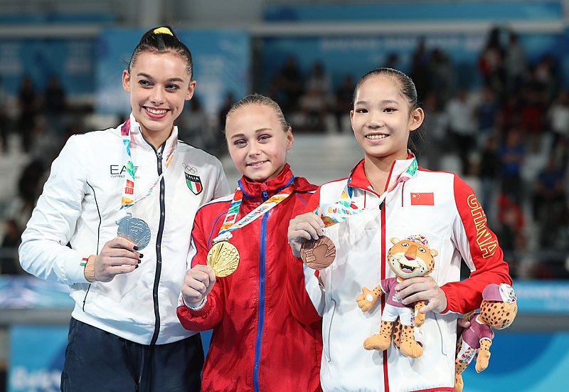 File:2018-10-13 Gymnastics at 2018 Summer Youth Olympics – Girls' Artistic Gymnastics – Apparatus finals – Uneven bars – Victory ceremony (Martin Rulsch) 44.jpg