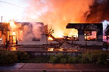 Fires burn at a Napa Auto Parts store on University Avenue in Saint Paul, May 28, 2020. 20200528- DSC7924 (49947268928).jpg