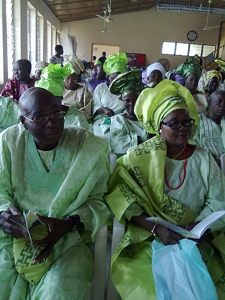 File:A Nigerian Yoruba woman in a lace Buba blouse, with Ipele and the gele headtie made from contemporary Aso Oke and A man in Agbada2.jpg