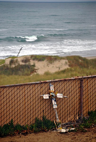 File:A make shift cross at surf Amtrak Station in remembrance of a surfer killed here Shark kills Surfer One of a series of photos taken from the Pacific Surfliner at Surf Amtrak station in California - panoramio.jpg