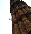 Aeroplane flying above Qutub Minar.JPG