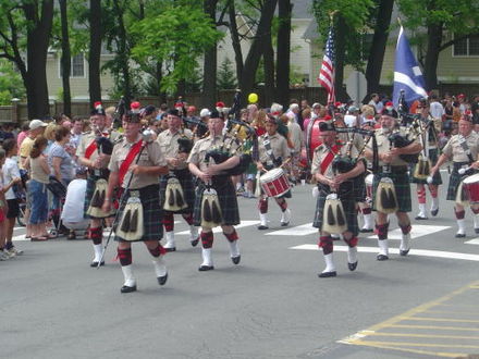 A Scottish bagpipe band marches in a Memorial Day parade in Falls Church.