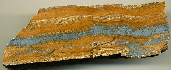 Banded iron formation, South Middleback Range, Eyre Peninsula. Orangish-brown = quartz mixed with limonite. Silvery-gray = hematite.