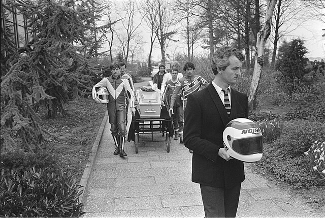 Wil Hartog (Carrying Middelburg's helmet),leads pall bearers during Middelburg's funeral.