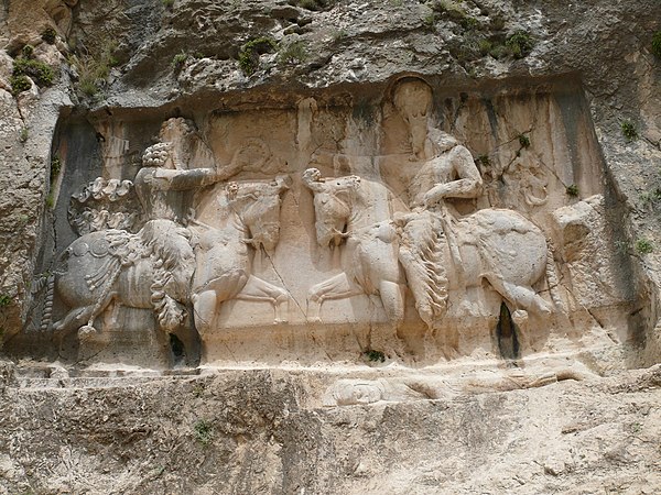 The rock relief of Bahram I receiving the royal diadem from the Zoroastrian supreme god Ahura Mazda, at the ancient city of Bishapur.