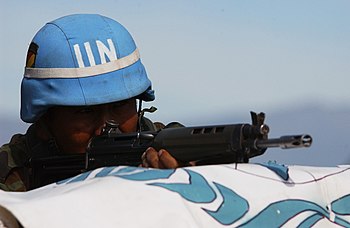 Bolivian soldier prepares to fire