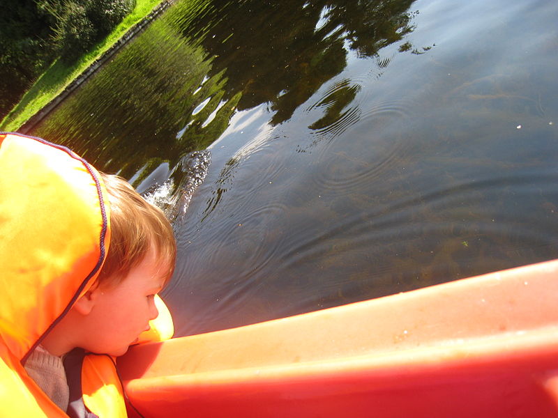 File:Boy Leaning Out of Boat.JPG