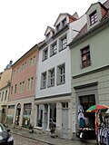 Residential building in closed development and rear building (side wing)