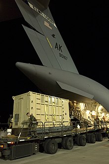 An elephant being transported by air in a custom-built crate. C-17 Elephant Transport.jpg