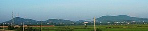 Mountains along the Cambodian-Thai Border north of the road between Serei Saophoan and Aranyaprathet. These were one of the areas where Khmer Rouge fighters hid at the time of the K5 Plan. Cambodia-mountainsW5.JPG