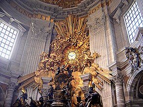 The chair-shaped bronze reliquary which holds the throne of St Peter is much larger than a normal chair, is ornate in shape and decorated with relief sculpture and gold leaf. The "Gloria" which surrounds a round window is a sculpture of clouds and sun-rays, surrounded by angels, the whole lot being covered in gleaming gold leaf.