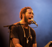 Cory Henry delivers stabs of a church organ throughout "24", which was his only contribution kept from eight recordings with West. Cory Henry.png