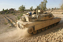 An M1A1 Abrams with a bustle rack and bustle rack extension packed full of gear. Defense.gov News Photo 040814-M-0706S-007.jpg