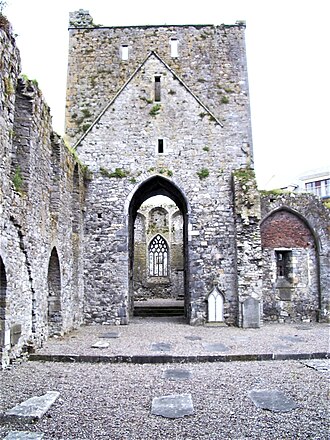 Interior of the abbey church; note the Gothic tracery in the window Dominics Abbey Cashel.jpg