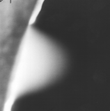 Air jet through 100 micrometre aperture into ESEM chamber held at 200 Pa, image taken with gaseous detection device, 15 kV