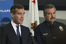 Garcetti with police chief Charlie Beck, discussing crime statistics in 2014 EricMichaelGarcetti.jpg