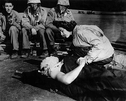 Navy flight nurse Jane Kendeigh and wounded Marine in Iwo Jima, 1945