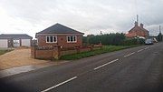 Thumbnail for File:Former level crossing looking towards Little Steeping..jpg