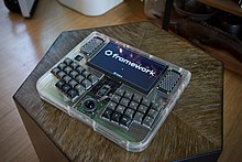 Framedeck, a Framework motherboard based cyberdeck with clear acrylic and brass influenced by TRS-80 Model 100 Framedeck framework logo.jpg