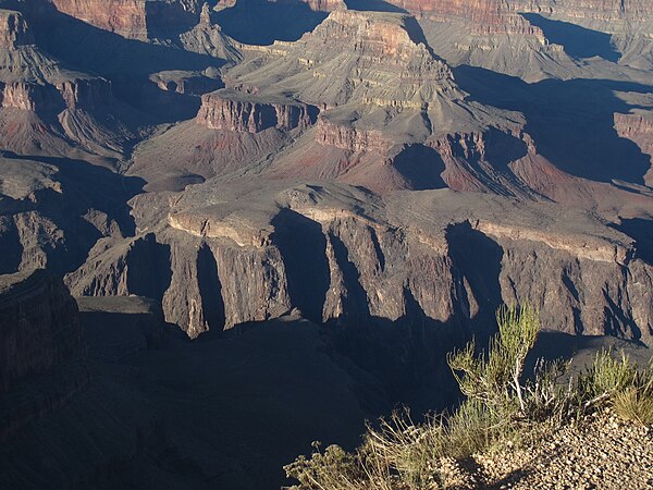 Powell's Unconformity seen from Hopi Point on the South Rim. Steeply foliated and veined schists of the Vishnu Basement Rocks truncated at the base of