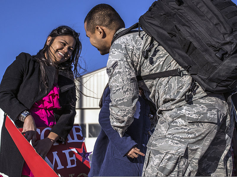 File:Hillary Paulino, left, looks on as her husband, U.S. Air Force Airman 1st Class Michael Paulino, an ammunition technician with the 366th Equipment Maintenance Squadron, hugs their daughter at Mountain Home Air 131003-F-WU507-164.jpg