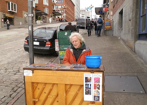 An amateur pianist playing outdoors at Pike Place market in Seattle.