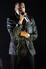 West holds his performance microphone at the O2 Arena in 2007