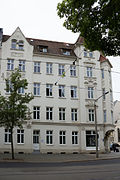 Apartment building with corner shop in closed development, corner house on Sattigstrasse