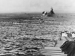 LVTs move toward Saipan, past bombarding cruisers, on 15 June 1944 (80-G-231838).jpg
